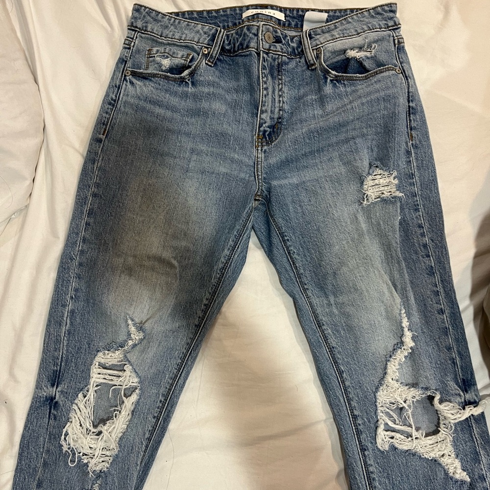 Ripped blue jeans